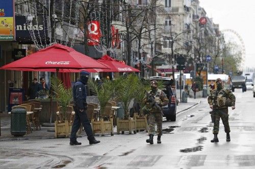 Belgian soldiers patrol in central Brussels after security was tightened in Belgium following the fatal attacks in Paris