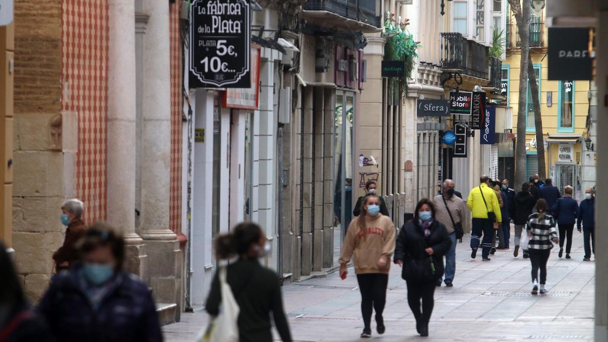 Imágenes de comercios de Málaga cerrados en el primer día de cierre de la actividad no esencial