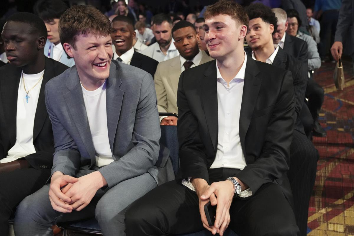 Duke's Kon Knueppel, left, and Cooper Flagg, right, smile at the NBA basketball draft lottery in Chicago, Monday, May 12, 2025. (AP Photo/Nam Y. Huh)