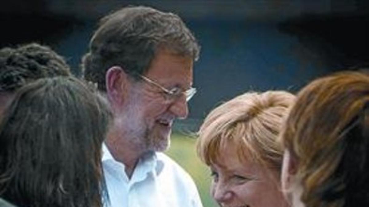 Rajoy y Merkel, en la reunión de la OTAN en Chicago, el 20 de mayo.