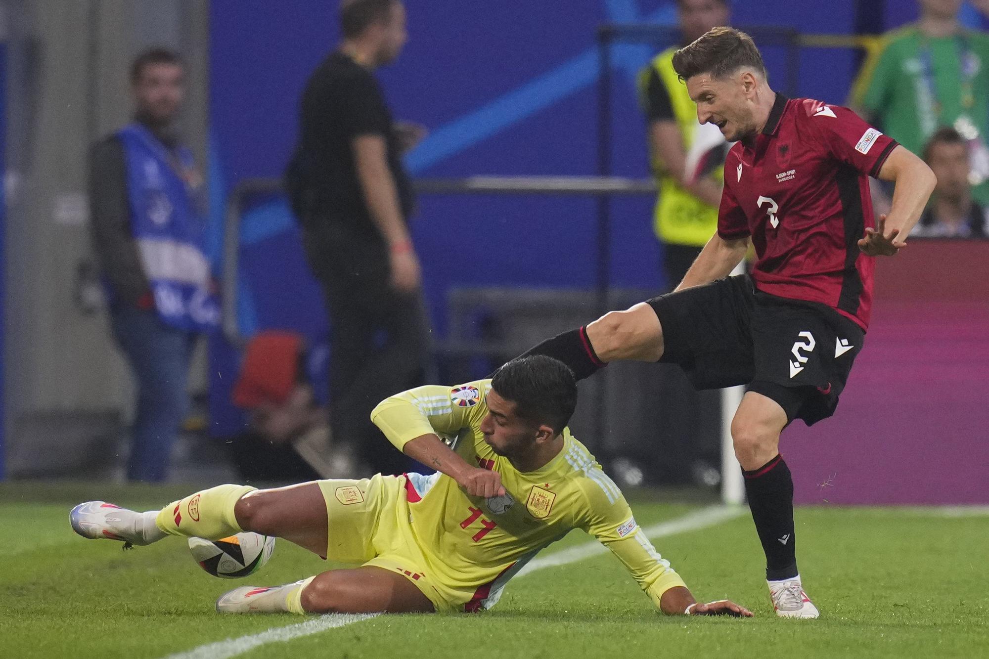 Spain's Ferran Torres, left, vies for the ball with Albania's Ivan Balliu during a Group B match between Albania and Spain at the Euro 2024 soccer tournament in Dusseldorf, Germany, Monday, June 24, 2024. (AP Photo/Manu Fernandez)