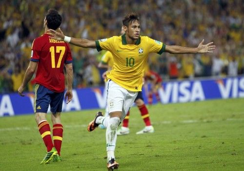Brazil's Neymar celebrates after scoring a goal against Spain during their Confederations Cup final soccer match at the Estadio Maracana in Rio de Janeiro