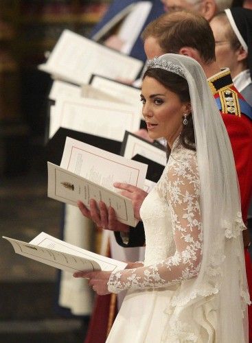 Kate Middleton, bride to Britain's Prince William sings during during their wedding ceremony at Westminster Abbey in central London
