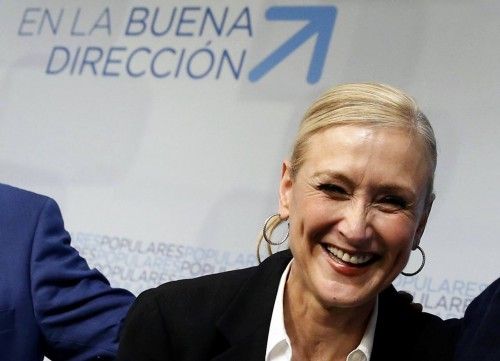 Cifuentes, Madrid's regional candidate of ruling People's Party (PP), smiles inside PP headquarters after the regional and municipal elections in Madrid