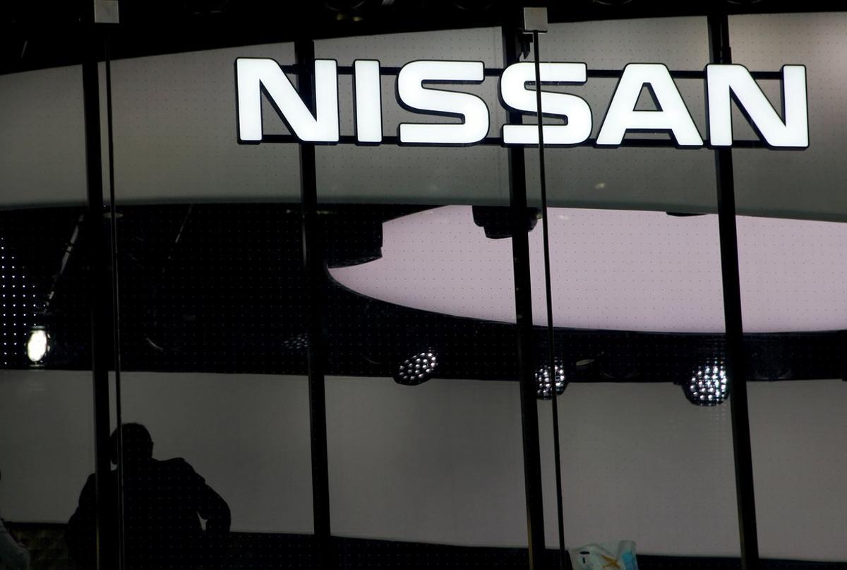 FILE PHOTO  A man is silhouetted at a show room of Nissan Motor Co  in Tokyo  Japan  February 12  2019  REUTERS Kim Kyung-hoon File Photo