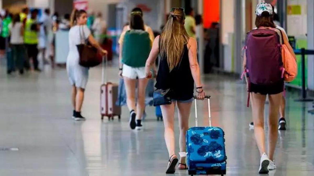 Tourists with suitcases at Ibiza Airport in a file photo.