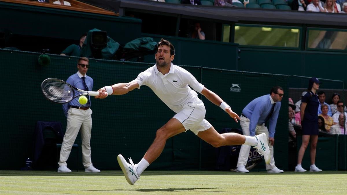 marcosl48887165 serbia s novak djokovic returns the ball to germany s philip190701161954