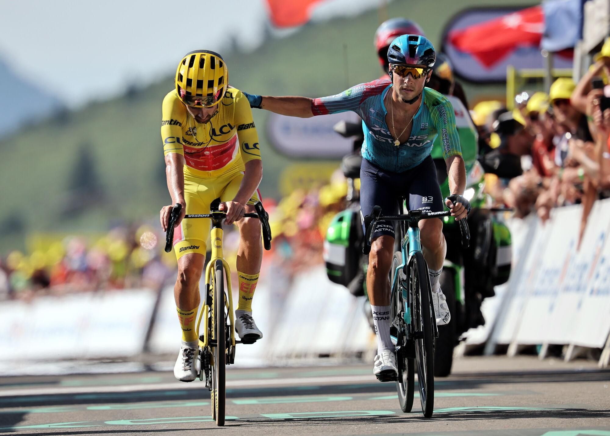 HAUTACAM (France), 17/07/2025.- The Yellow Jersey overall leader Irish rider Ben Healy of EF Education - EasyPost team (L) and Italian Simone Velasco of XDS Astana team arrive at the finish of the 12th stage of the Tour de France cycling race over 180.6km from Auch to Hautacam, France, 17 July 2025. (Ciclismo, Francia) EFE/EPA/CHRISTOPHE PETIT TESSON