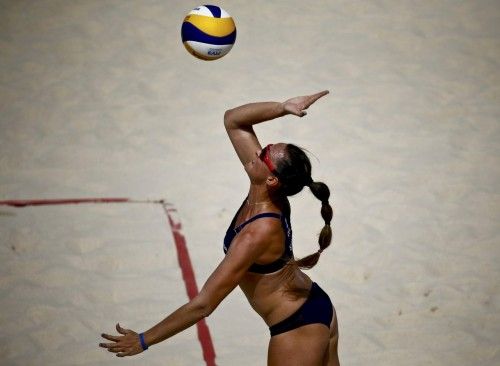 Gioria of Italy serves the ball during their preliminary beachvolleyball match against Belarus at the 1st European Games in Baku