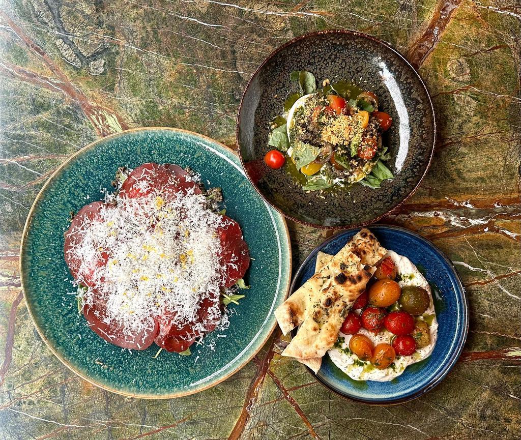 Carpaccio de Bresaola, Stracciatella y Burrata Olivada de V Modern Italian,.