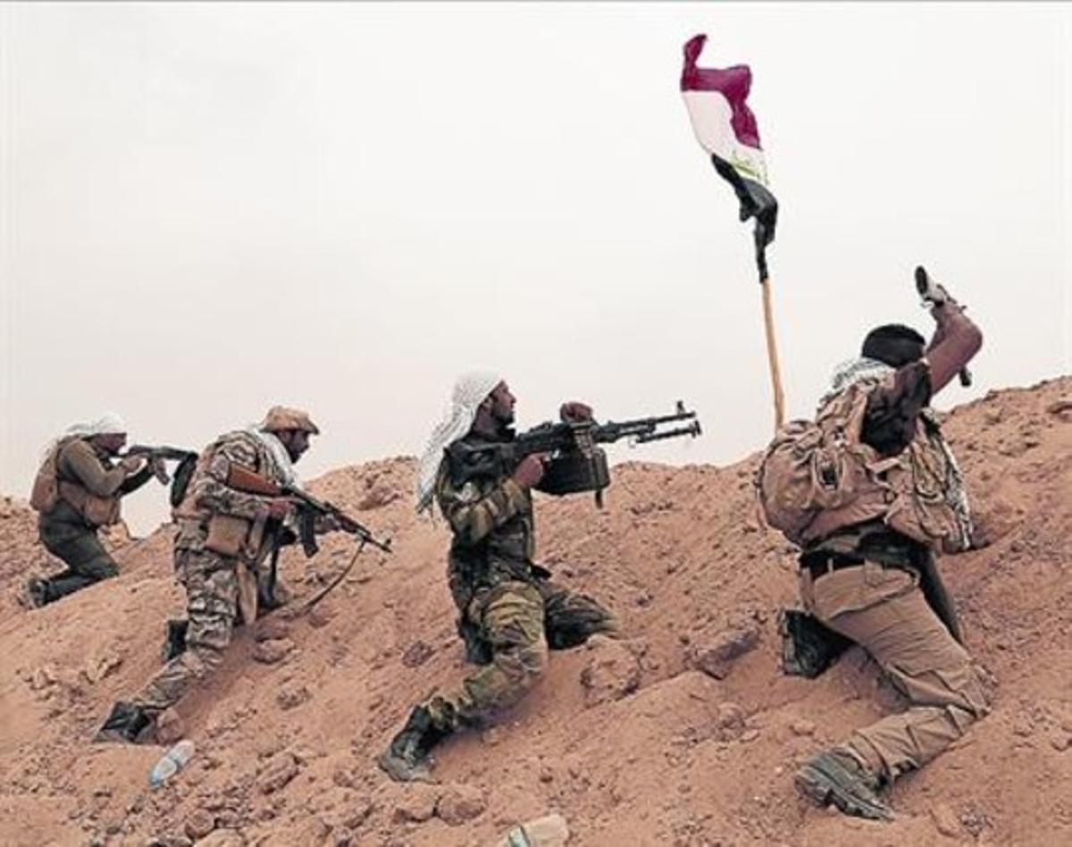 Militants xiïtes lluiten contra l’Estat Islàmic a Fal·luja.