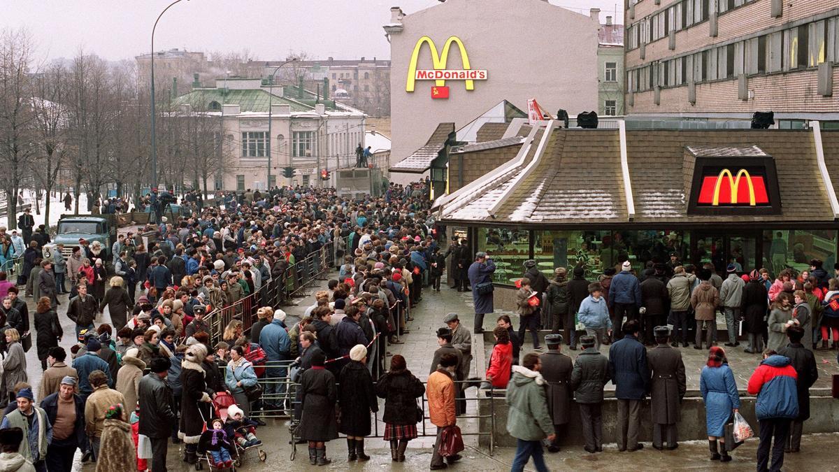 In this file photo taken on January 31, 1990, Soviet customers stand in line outside the just opened first McDonald's in the Soviet Union at Moscow's Pushkin Square. - American fast-food giant McDonald's will exit the Russian market and sell its business in the increasingly isolated country, the company said May 16, 2022. In a statement McDonald's said: &quot;After more than 30 years of operations in the country, McDonald's Corporation announced it will exit the Russian market and has initiated a process to sell its Russian business. Many Western businesses have pulled out of Russia since its invasion of Ukraine in February. (Photo by VITALY ARMAND / AFP)