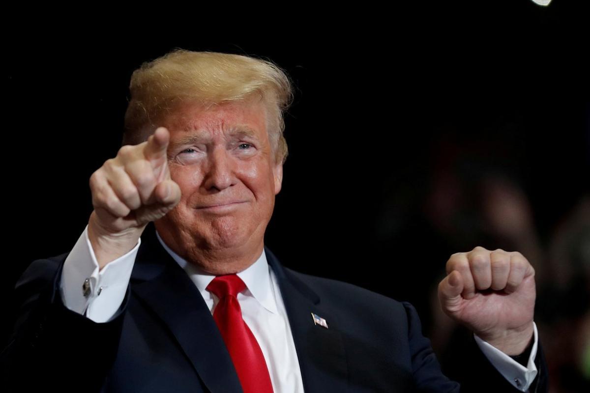 FILE PHOTO:    U.S. President Donald Trump gestures at a campaign rally on the eve of the U.S. mid-term elections at the Show Me Center in Cape Girardeau, Missouri, U.S., November 5, 2018.  REUTERS/Carlos Barria/File Photo