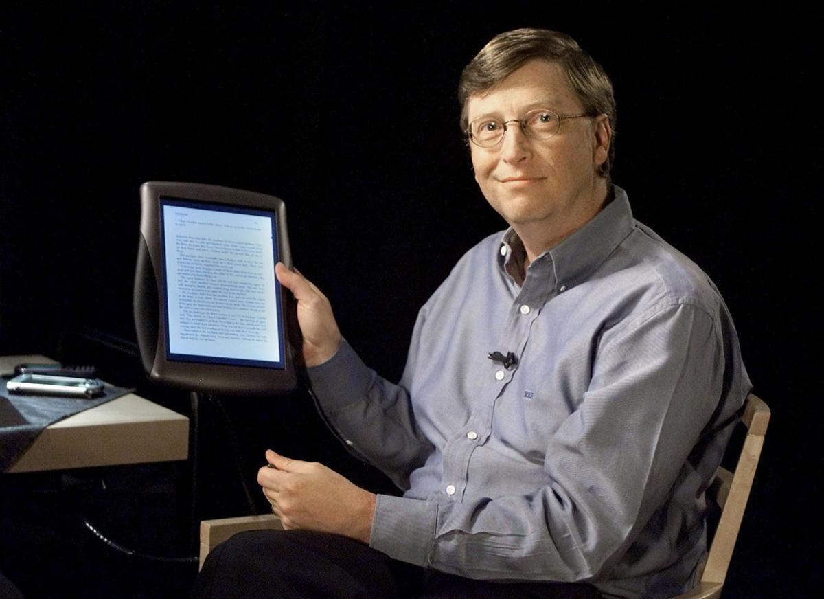 Bill Gates, Chairman and Chief Software Architect of Microsoft, holds a tablet PC Thursday, June 22, 2000, during Forum 2000, at Microsoft headquarters in Redmond, Wash. The small handheld PC is not on the market yet, but it will play a part of Microsoft’s vision for the next generation of the Internet, called .Net software. The initiative, called Microsoft.NET, will allow users to access data from a wide array of devices, including personal computers, handheld organizers and cell phones. The deviceswill communicate behind the scenes, coordinating between themselves and constantly updating each other, Gates said.  (AP Photo/Jeff Christensen)