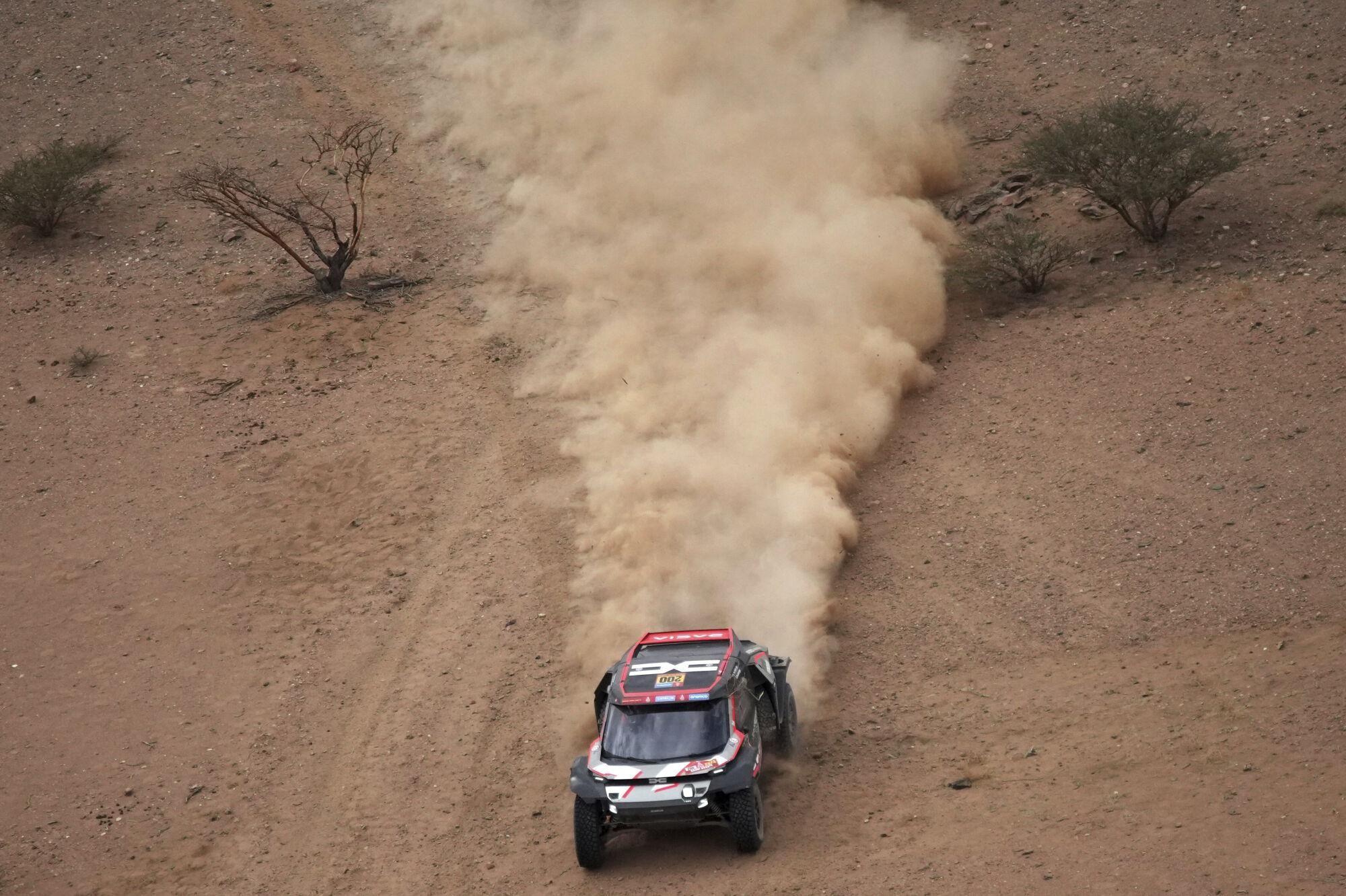 Driver Nasser Al-Attiya, and co-driver Edouard Boulanger drive their Daccia during the seventh stage of the Dakar Rally with start and finish in Al Duwadimi, Saudi Arabia, Sunday, Jan. 12, 2025. (AP Photo/Christophe Ena). EDITORIAL USE ONLY/ONLY ITALY AND SPAIN