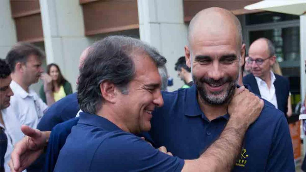 Guardiola, junto a Joan Laporta