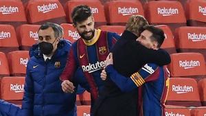 Pique and Messi hug