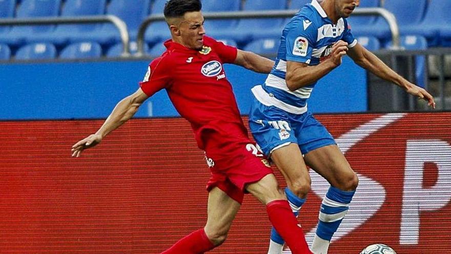 Alberto Fernández i Sabin Merino, durant el duel d&#039;ahir a Riazor.