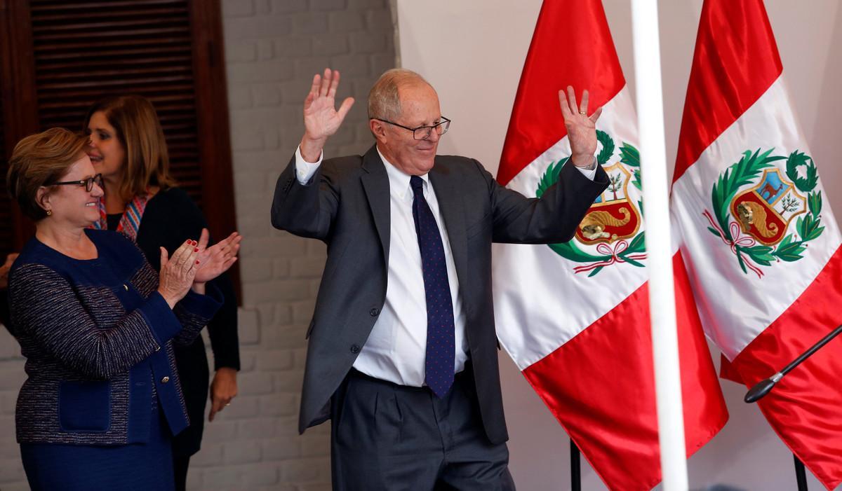 Peruvian presidential candidate Pedro Pablo Kuczynski, accompanied by his wife Nancy Lange (L), gives a speech to the press after Peru’s electoral office ONPE said that he won more votes than Keiko Fujimori in the country’s cliffhanger presidential election in his headquarters in Lima, Peru, June 9, 2016.  REUTERS/Janine Costa