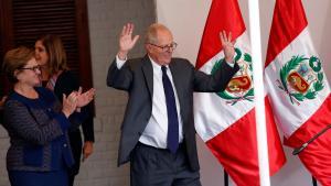 Peruvian presidential candidate Pedro Pablo Kuczynski, accompanied by his wife Nancy Lange (L), gives a speech to the press after Peru’s electoral office ONPE said that he won more votes than Keiko Fujimori in the country’s cliffhanger presidential election in his headquarters in Lima, Peru, June 9, 2016.  REUTERS/Janine Costa