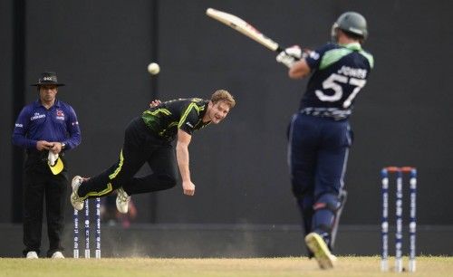 Australia's Watson looks on after bowling as Ireland's Jones hits out during the ICC World Twenty20 group B match at the R. Premadasa Stadium, Colombo