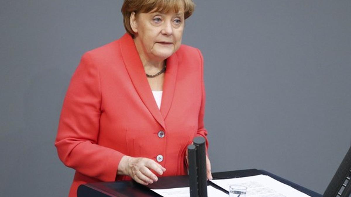 German Chancellor Merkel addresses the session of the German lower house of parliament Bundestag in Berlin