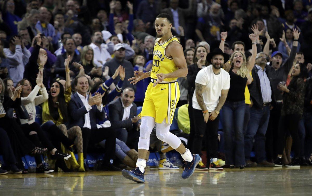 Golden State Warriors’ Stephen Curry celebrates a score against the Sacramento Kings in the second half of an NBA basketball game Thursday, Feb. 21, 2019, in Oakland, Calif. (AP Photo/Ben Margot)