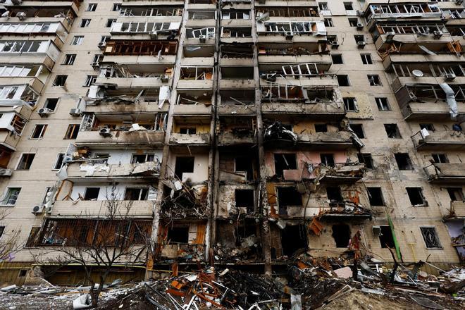 A residential building is damaged, after Russia launched a massive military operation against Ukraine, in Kyiv