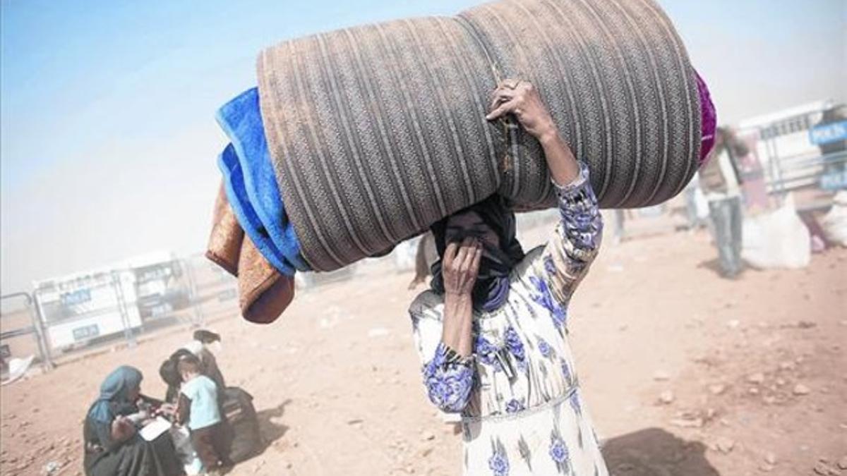 Una refugiada kurda de Siria tras haber cruzado la frontera con Turquía.