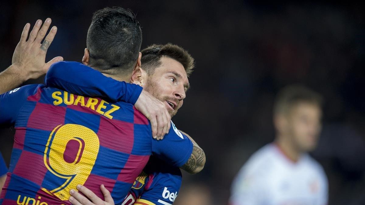 Messi y Suárez festejan un gol del Barça en el Camp Nou.