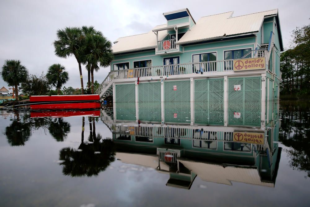 A house surrounded by flood waters is pictured ...