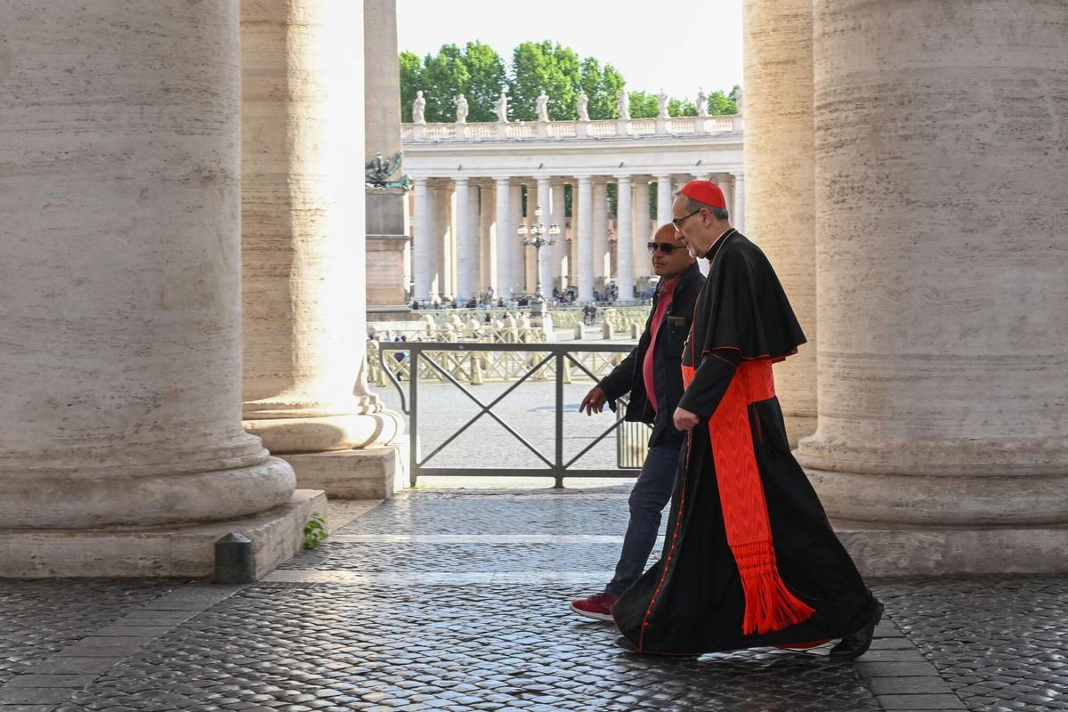 Italian cardinal and Latin Patriarch of Jerusalem Pierbattista Pizzaballa (centre R) walks under the colonnade as he arrives for a congregation meeting at The Vatican, on May 6, 2025. (Photo by Stefano Rellandini / AFP)