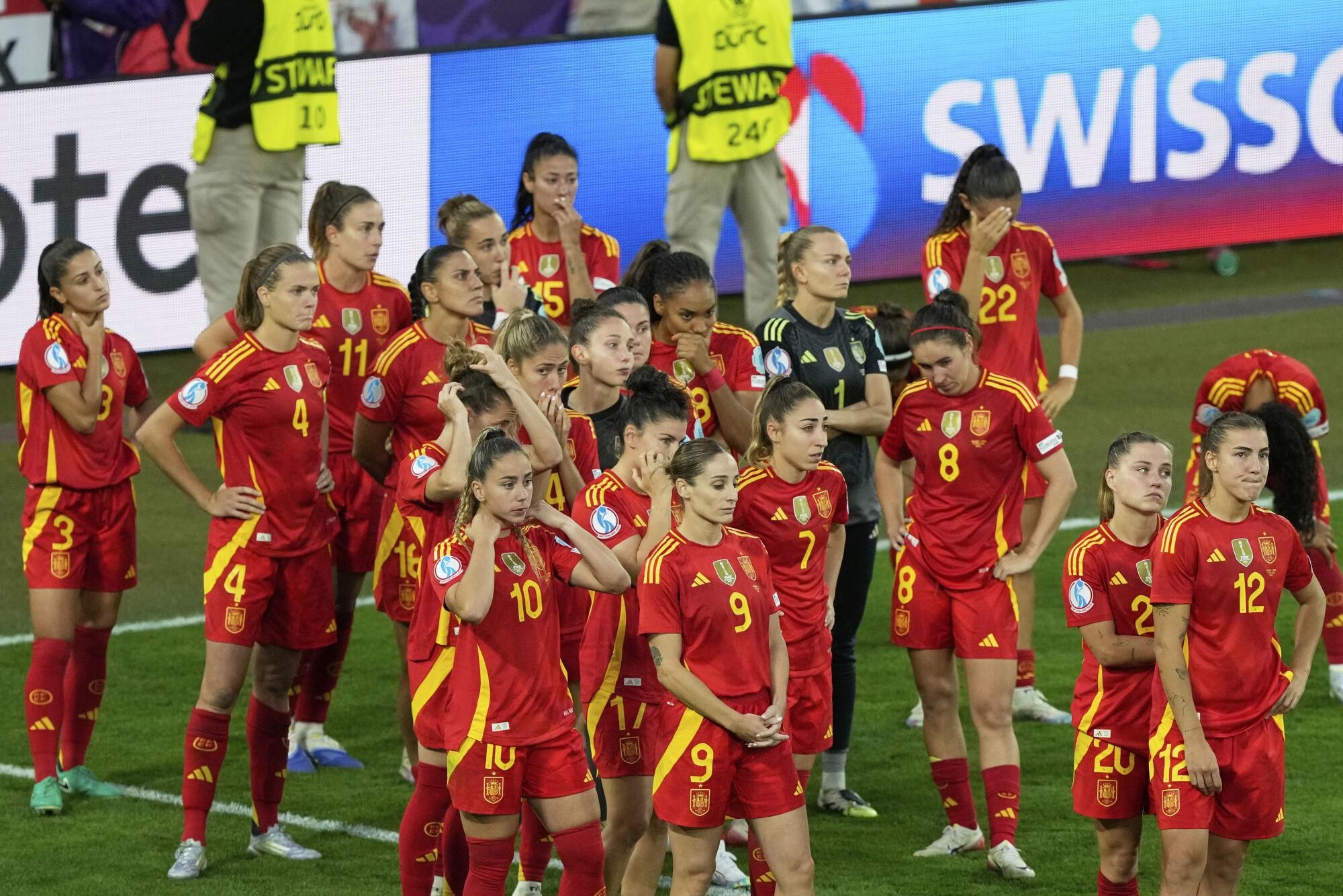 Spain players react after the Women's Euro 2025 final soccer match between England and Spain at St. Jakob-Park in Basel, Switzerland, Sunday, July 27, 2025. (AP Photo/Michael Probst)
