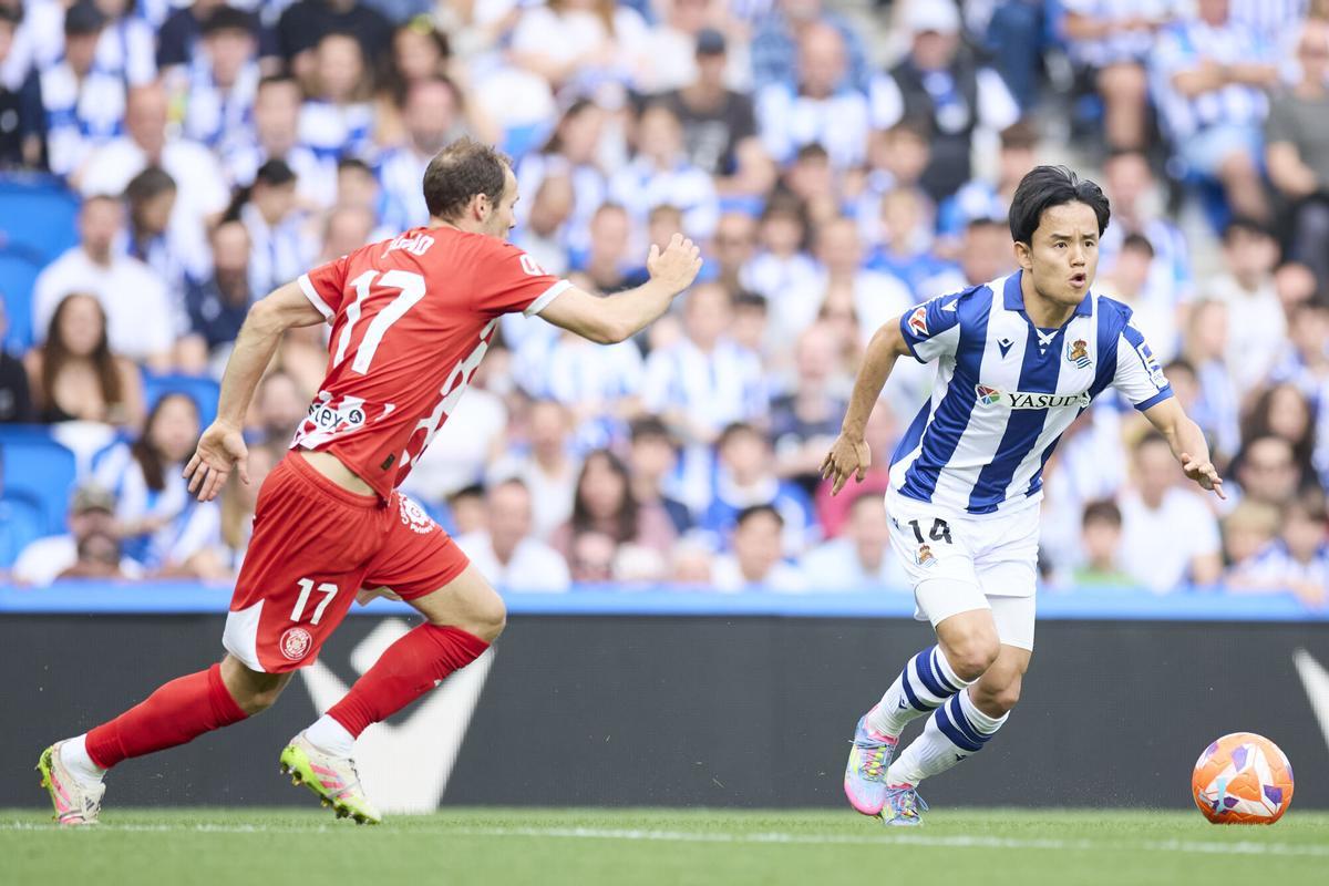 Takefusa Kubo of Real Sociedad competes for the ball with Daley Blind of Girona FC during the LaLiga EA Sports match between Real Sociedad and Girona FC at Reale Arena on May 18, 2025, in San Sebastian, Spain. AFP7 18/05/2025 ONLY FOR USE IN SPAIN. Ricardo Larreina / AFP7 / Europa Press;2025;SPAIN;SPORT;ZSPORT;SOCCER;ZSOCCER;Real Sociead v Girona FC - LaLiga EA Sports;