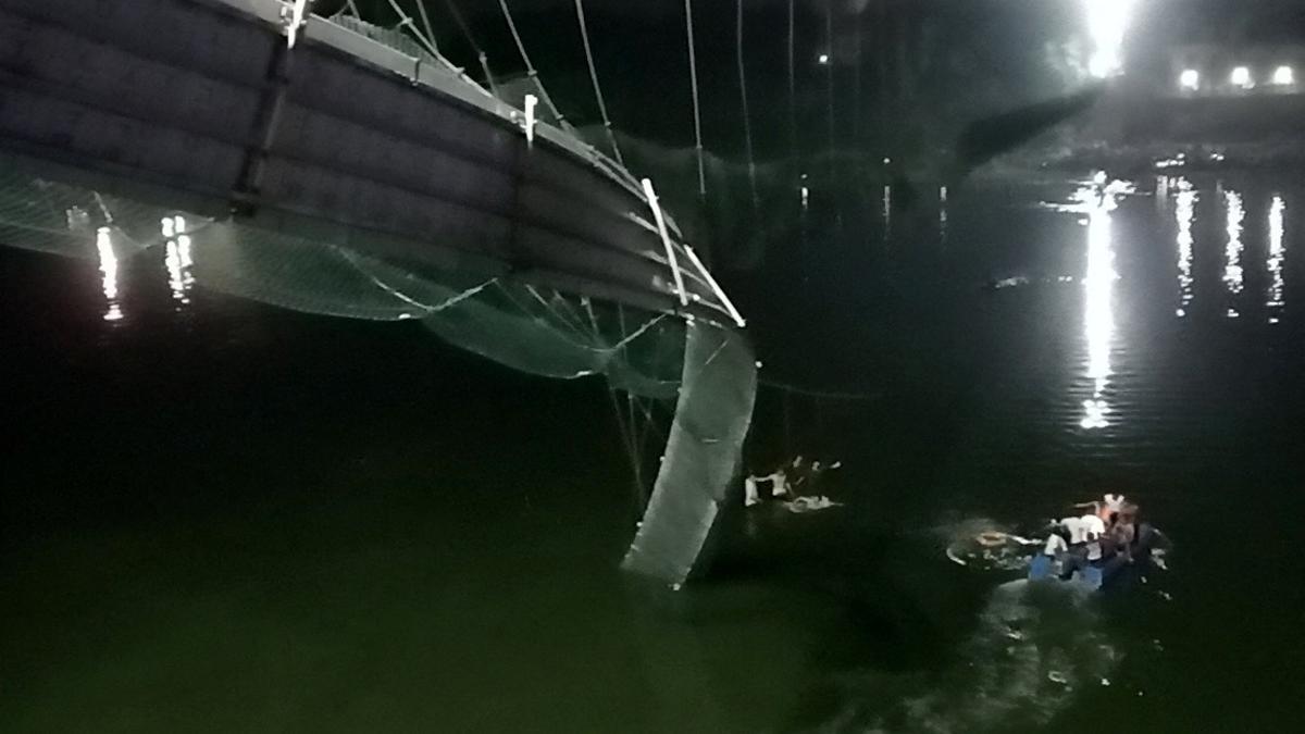 A view shows a damaged part of a suspension bridge after it collapsed in Morbi