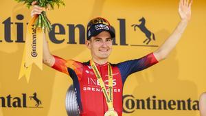 FILED - 15 July 2023, France, Morzine Les Portes du Soleil: Spanish cyclist Carlos Rodriguez of Ineos Grenadiers celebrates on the podium after winning the 14th stage of the 110th edition of the Tour de France cycling race, 152 km between Annemasse and Mo