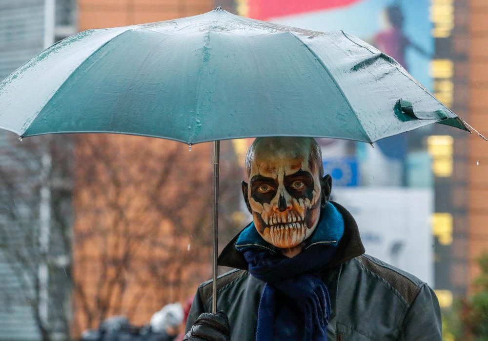 A protestor with make-up depicting a skulls ...