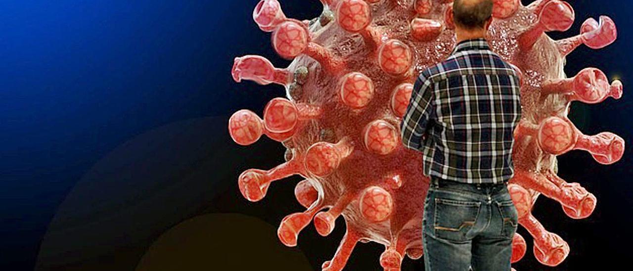 Un hombre observa una réplica de coronavirus.