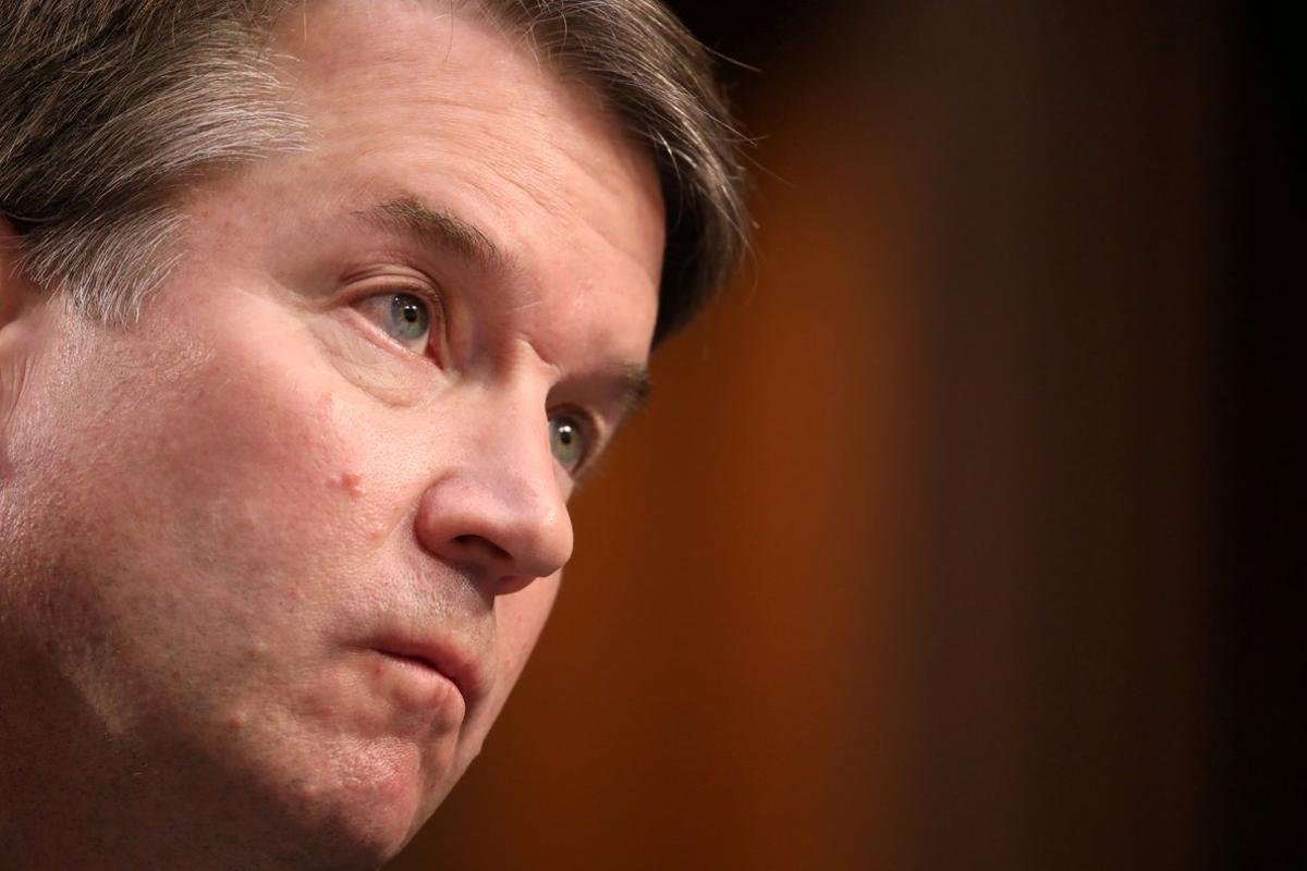 FILE PHOTO: U.S. Supreme Court nominee judge Brett Kavanaugh looks on during his Senate Judiciary Committee confirmation hearing on Capitol Hill in Washington, U.S., September 4, 2018. REUTERS/Chris Wattie/File Photo