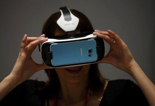 A woman uses a Samsung's new virtual reality (VR) headset called the Gear VR Innovation Edition during the Mobile World Congress in Barcelona