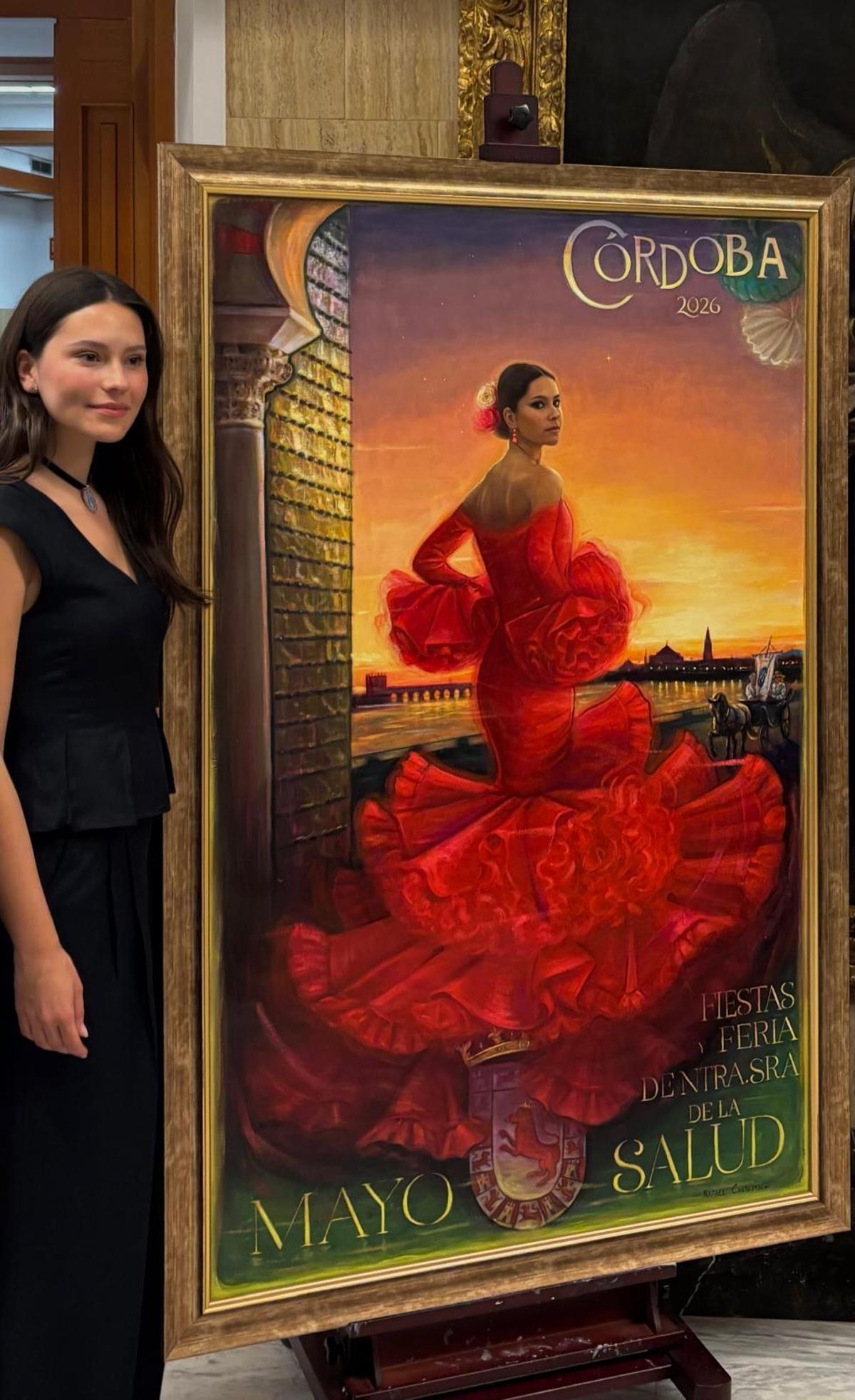 Nuria Rodríguez, con el cartel anunciador de las Fiestas de Mayo de Córdoba 2026.