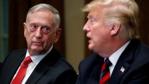 FILE PHOTO  U S  Defense Secretary James Mattis listens as U S  President Donald Trump speaks to the news media while gathering for a briefing from his senior military leaders in the Cabinet Room at the White House in Washington  U S   October 23  2018  REUTERS Leah Millis File Photo