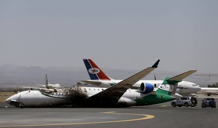 A Felix Airways plane is seen after it was destroyed by an air strike at the international airport of Yemen's capital Sanaa