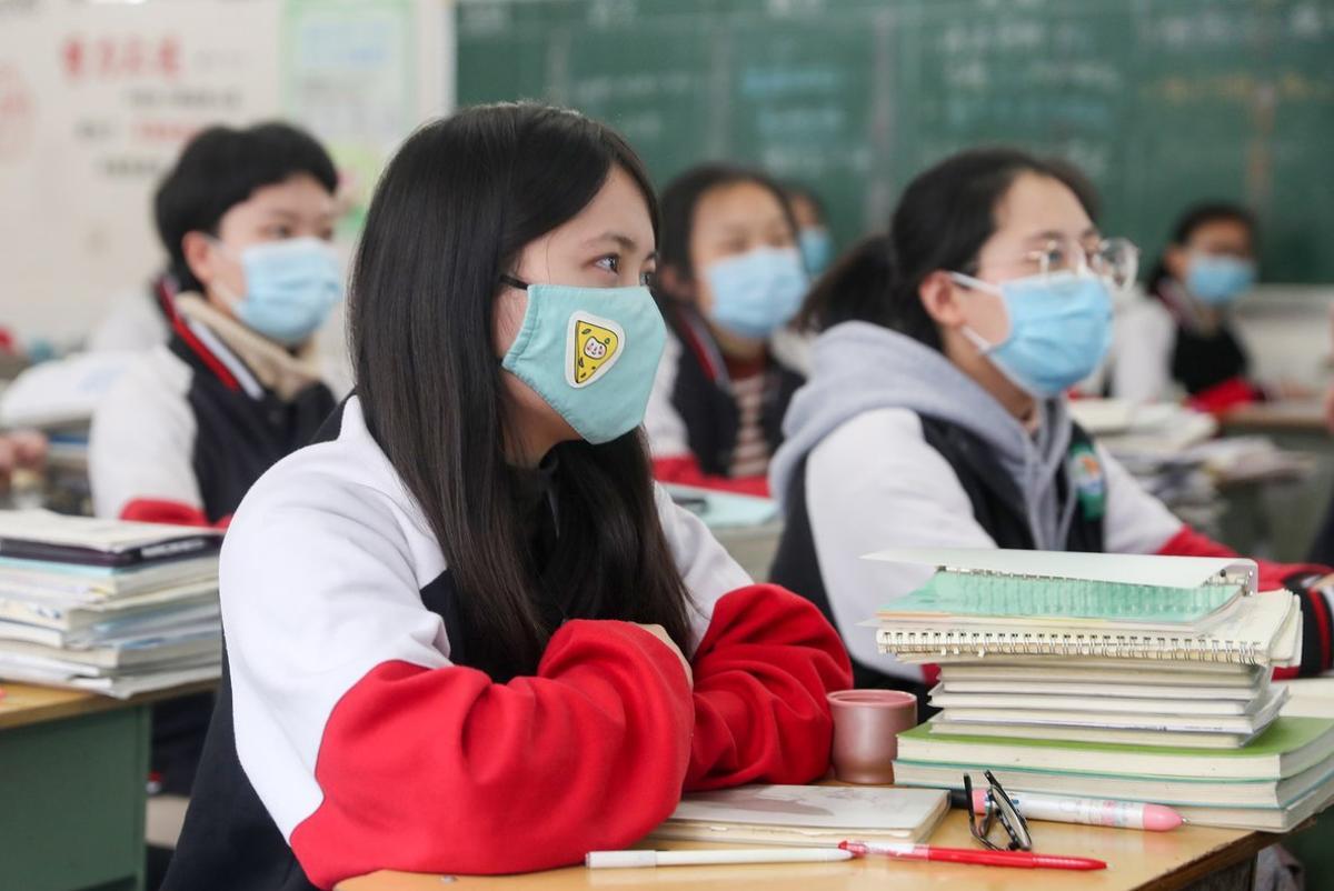 09 April 2020, China, Chongqing: High school grade students wearing face masks attend a class after the term opening was delayed due to the Coronavirus (Covid-19) outbreak. Photo: -/SIPA Asia via ZUMA Wire/dpa