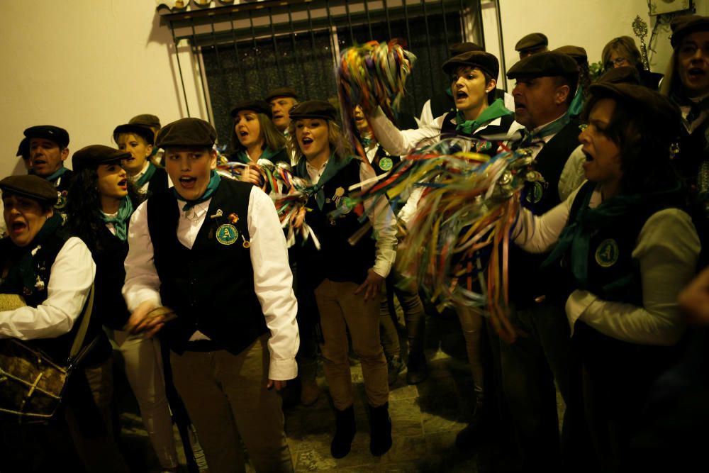 Villagers sing Christmas carols during the ...