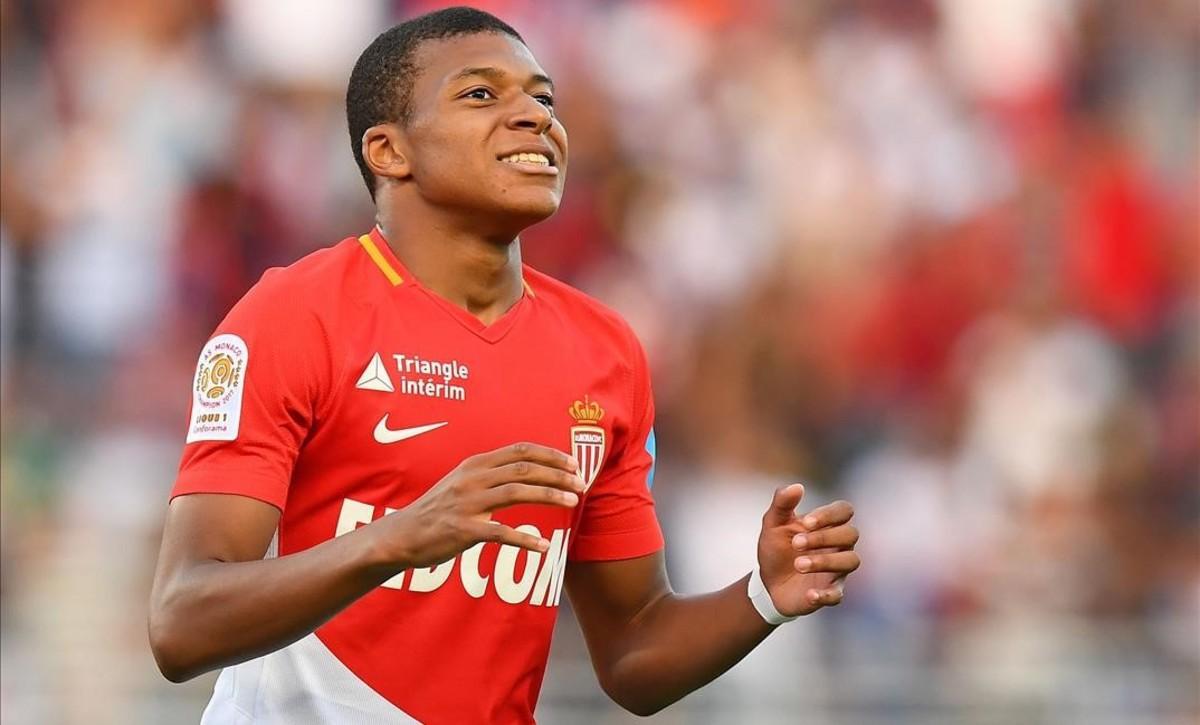 undefined39493338 monaco s french forward kylian mbappe reacts after missing a170803175020