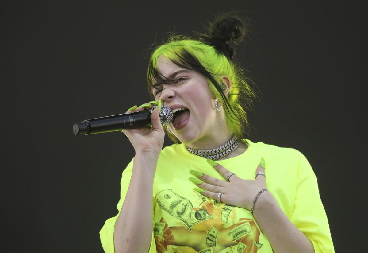 FILE - In this Oct. 5, 2019 photo, Billie Eilish performs during the first weekend of the Austin City Limits Music Festival in Zilker Park in Austin, Texas. Eilish will be the first recipient of the Apple Music Award for global artist of the year, one of three honors for the pop singer. Apple announced Monday that Eilishâs âWhen We All Fall Asleep, Where Do We Go?â has been named album of the year.  Eilish and her brother Finneas will also receive songwriter of the year honors. (Photo by Jack Plunkett/Invision/AP, File)