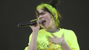 FILE - In this Oct. 5, 2019 photo, Billie Eilish performs during the first weekend of the Austin City Limits Music Festival in Zilker Park in Austin, Texas. Eilish will be the first recipient of the Apple Music Award for global artist of the year, one of three honors for the pop singer. Apple announced Monday that Eilishâs âWhen We All Fall Asleep, Where Do We Go?â has been named album of the year.  Eilish and her brother Finneas will also receive songwriter of the year honors. (Photo by Jack Plunkett/Invision/AP, File)