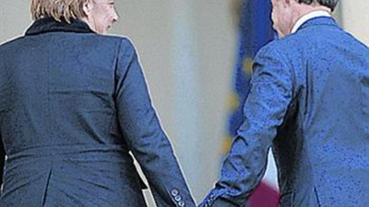 Merkel y Sarkozy, el lunes, en París.