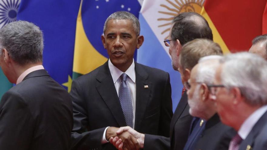 Rajoy y Obama se saludan al inicio de la cumbre del G-20